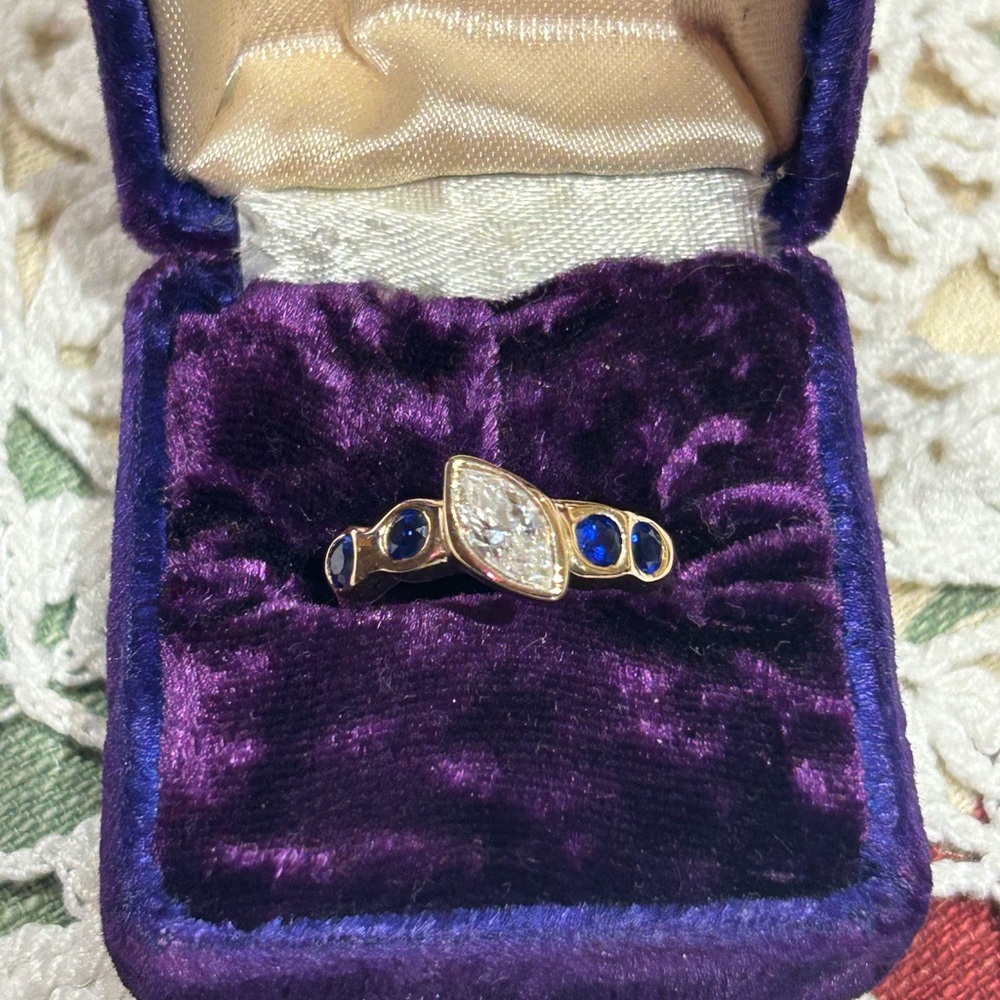 14k YG bezel set .85 carat marquise diamond and sapphire ring size 5.75/6